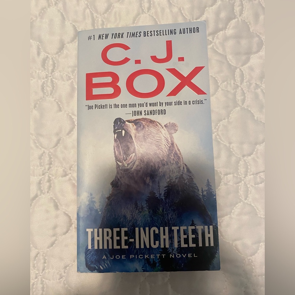 C.J. Box 'Three-Inch Teeth' Novel. Like new, great condition.
